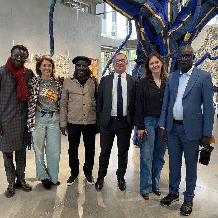 Kalidou Kassé’s work was featured at the Chanel Group exhibition in Paris, attended by Mr. Bruno Pavlovsky, President of Chanel, and Professor El Hadj Malick Ndiaye, Artistic Director.