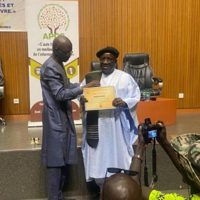 Official presentation of a certificate honoring Kalidou Kassé as Benefactor of the Association of Cultural Press of Senegal.
