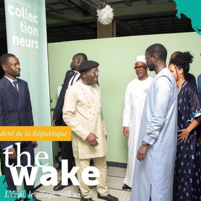 Kalidou Kassé, curator of the Collectors’ Exhibition, welcoming the President of the Republic of Senegal, His Excellency Mr. Bassirou Diomaye Faye, during the 15th edition of the Dakar Biennale in 2025.